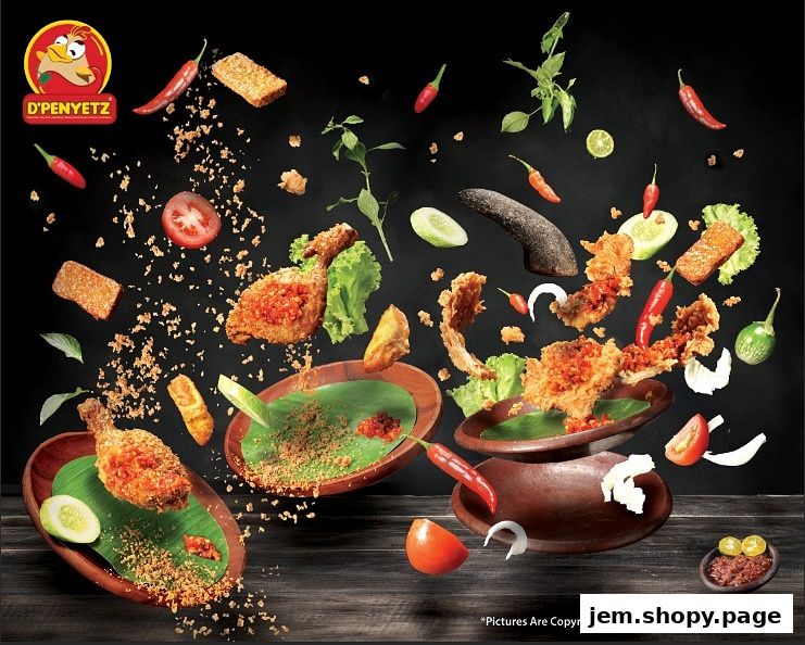 A dynamic arrangement of fried chicken, tempeh, and fresh ingredients against a dark background.