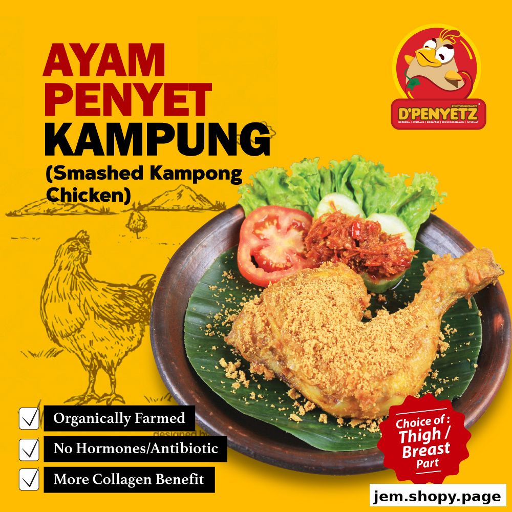 A delicious plate of Ayam Penyet Kampung (Smashed Kampong Chicken) with fresh vegetables.