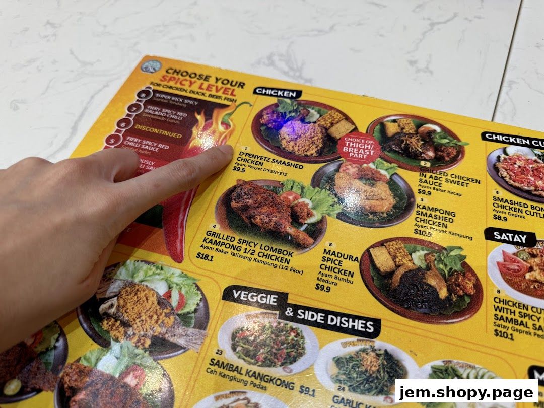 A menu from DPenyetz Jem featuring spicy chicken dishes and side dishes.