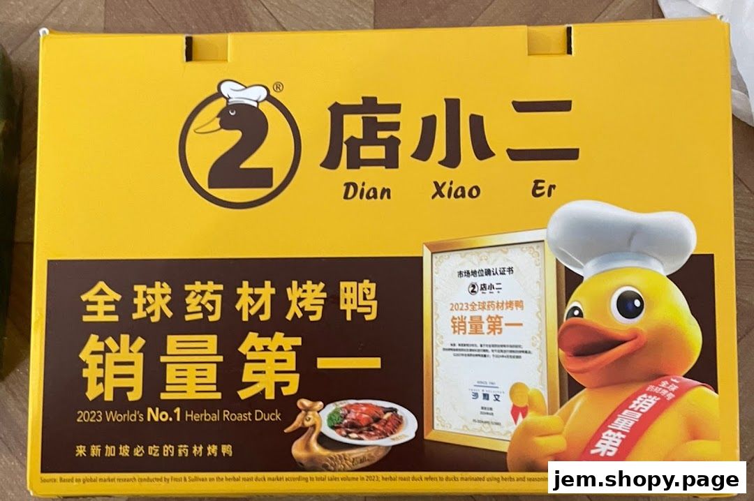 A yellow box with the Dian Xiao Er logo, featuring a cartoon duck and text about their roast duck.
