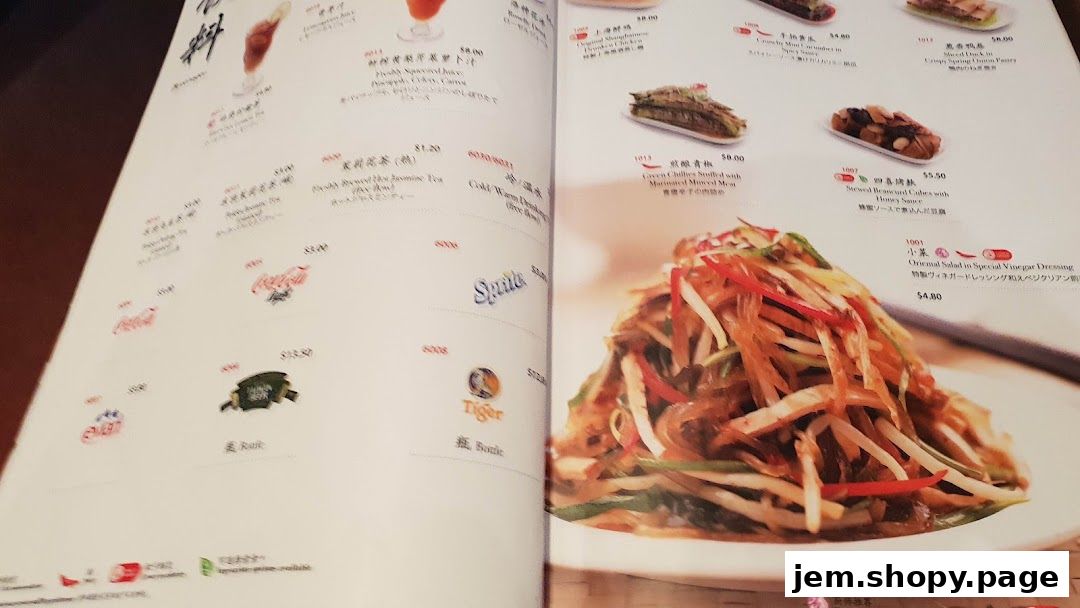 A menu from Din Tai Fung showing various dishes and drinks with prices.