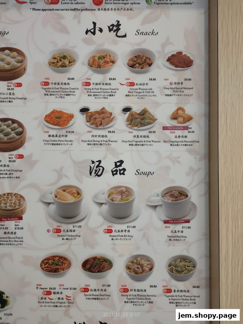 A menu from Din Tai Fung featuring snacks and soups with prices and descriptions.