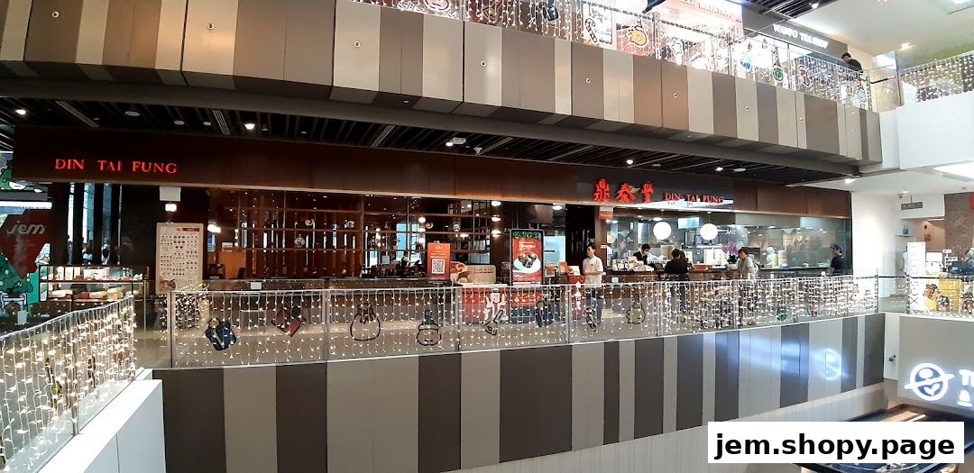 The exterior of the popular Din Tai Fung restaurant at Jem mall, showcasing its inviting interior.