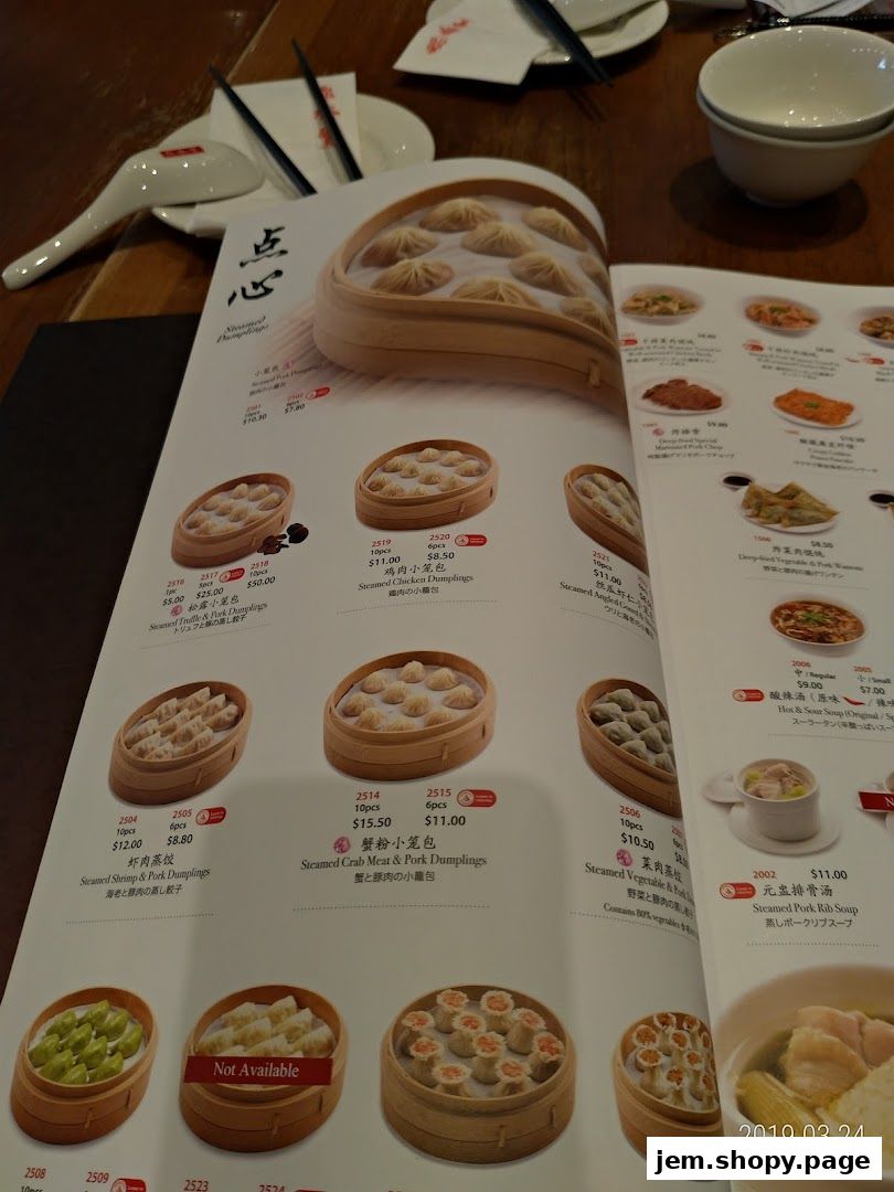 A menu from Din Tai Fung featuring various steamed dumplings and soups.