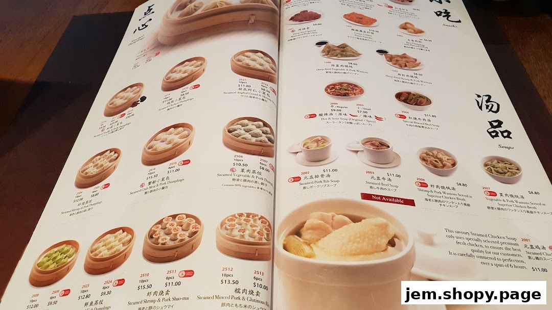 A menu from Din Tai Fung featuring various steamed dumplings, soups, and other dishes.