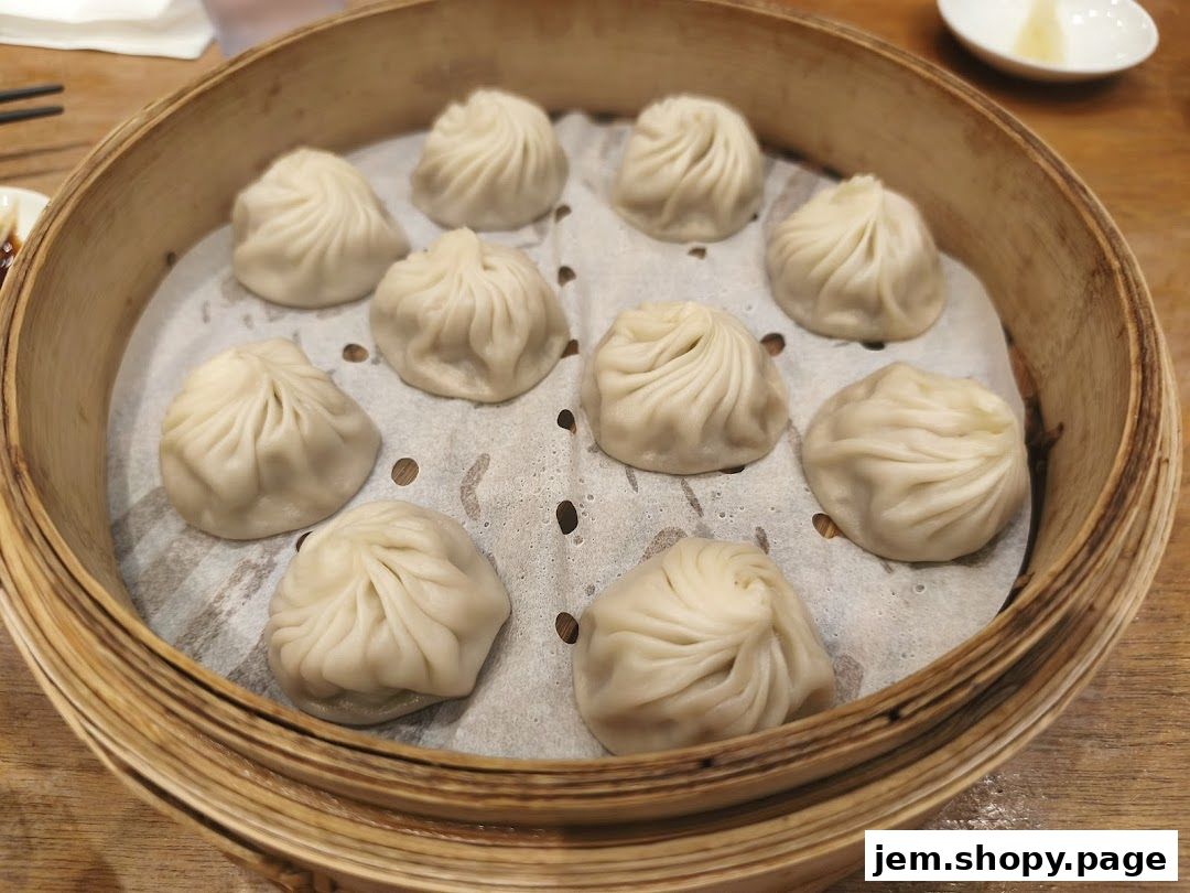 A bamboo steamer basket filled with delicious Xiao Long Bao soup dumplings.