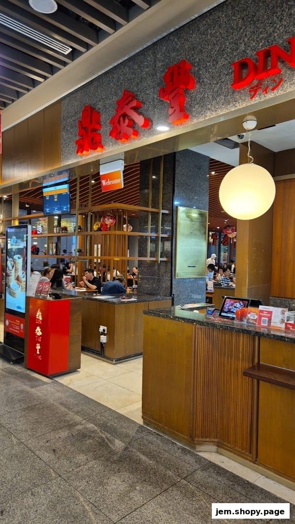 Interior view of Din Tai Fung restaurant with seating and counter area.
