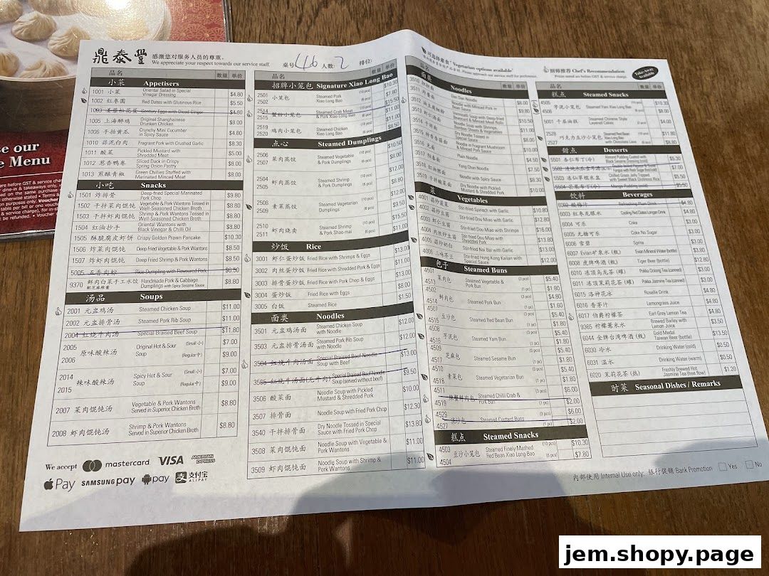 A menu from Din Tai Fung featuring appetizers, snacks, soups, noodles, rice, and beverages.
