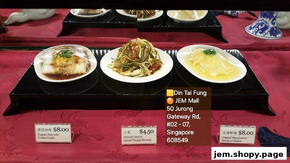 Display of three popular dishes from Din Tai Fung at JEM Mall with prices.