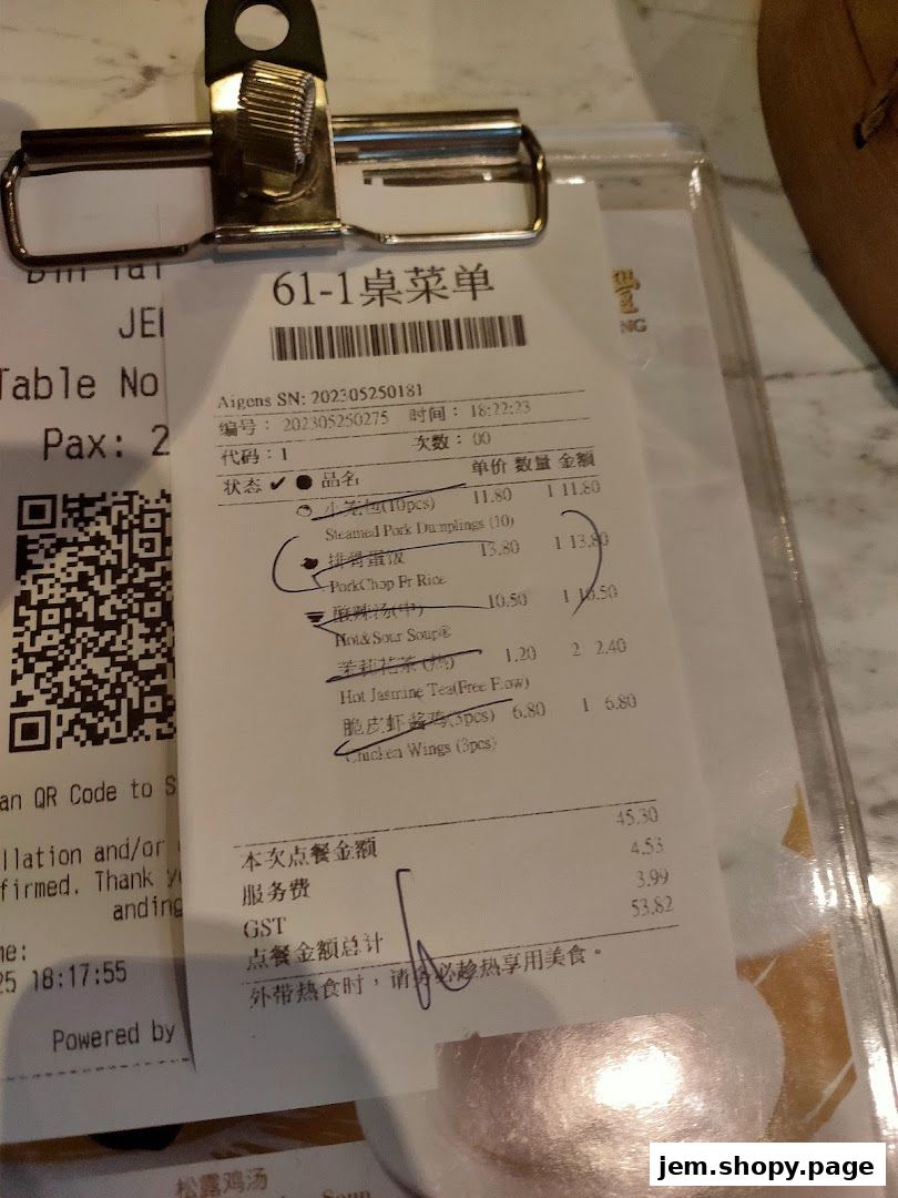 A close-up of a Din Tai Fung restaurant receipt showing ordered items and prices.