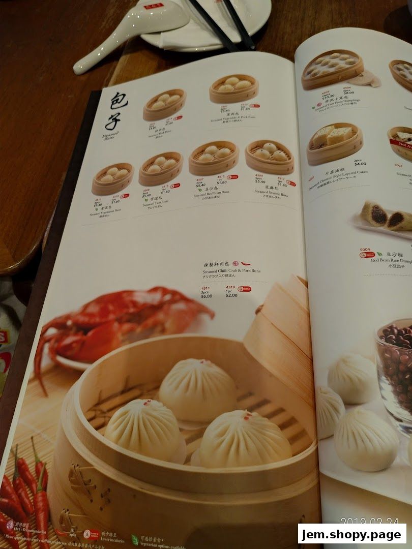 A menu from Din Tai Fung featuring various steamed buns and dumplings with enticing food photography.
