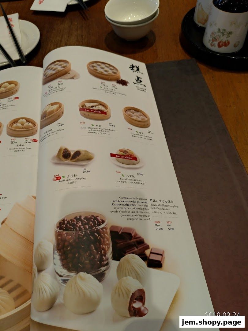 A menu page from Din Tai Fung featuring dumplings, rice cakes, and sweet buns.