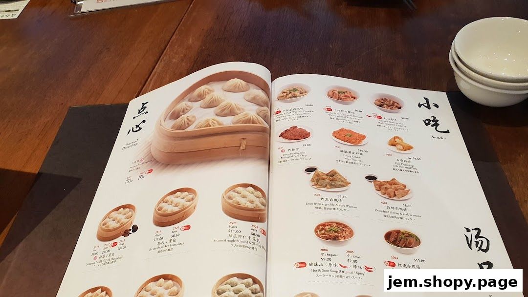 A menu from Din Tai Fung featuring various dumplings and other Chinese dishes.