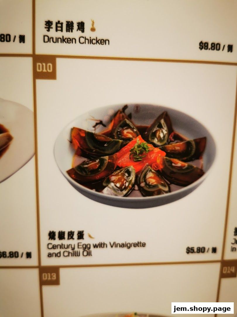 A menu display showing Drunken Chicken and Century Egg dishes with prices.