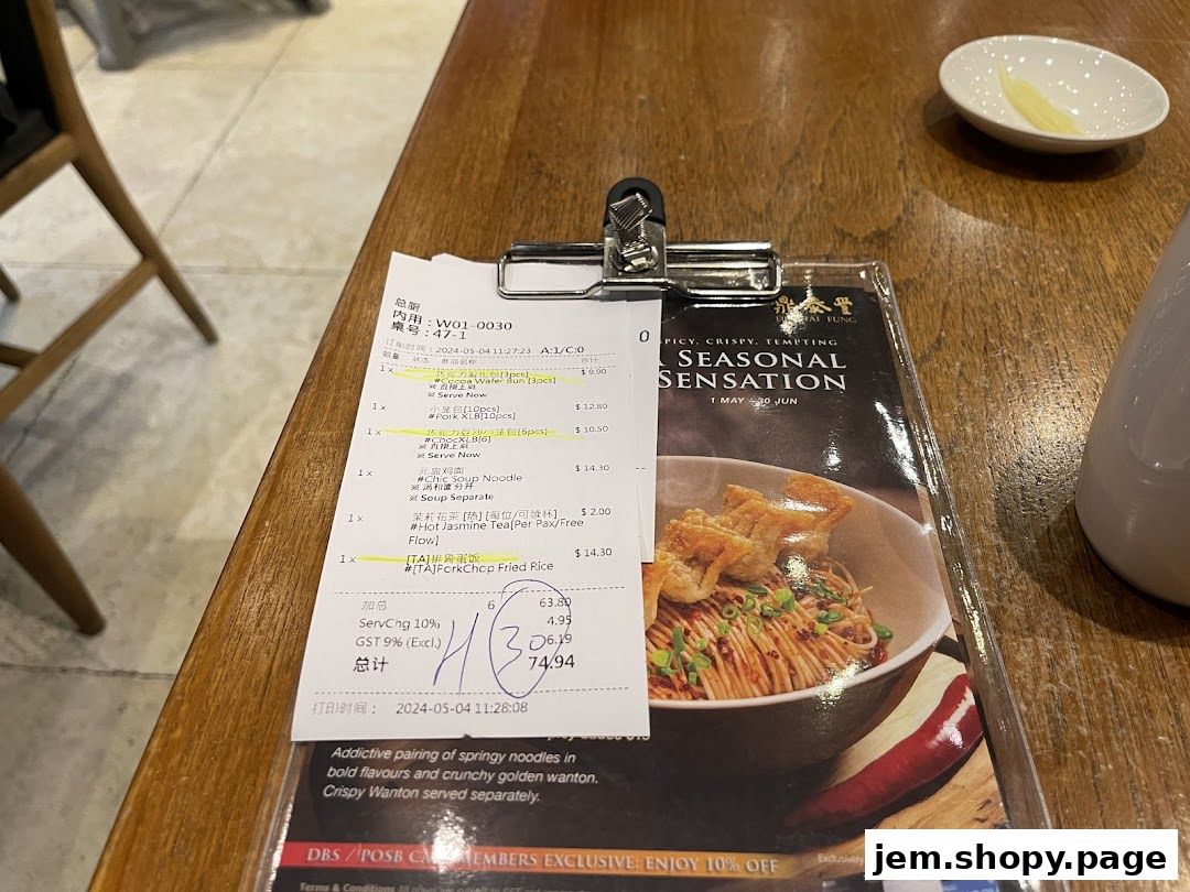 A receipt and a menu from Din Tai Fung showing a seasonal noodle dish.