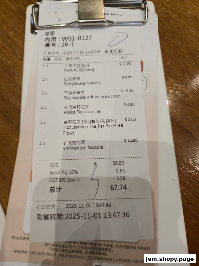 A receipt from Din Tai Fung showing a list of food and drinks ordered, with prices.