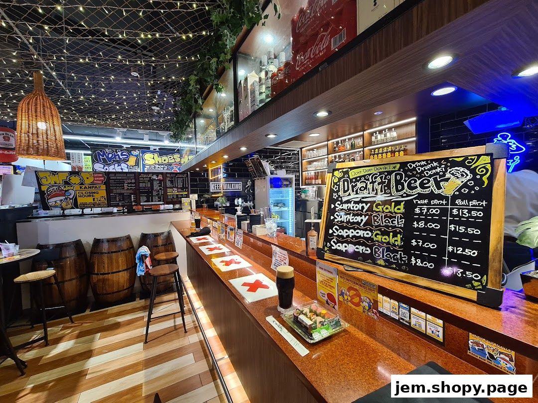A bar counter with a draft beer menu and seating, featuring Japanese-style decor.