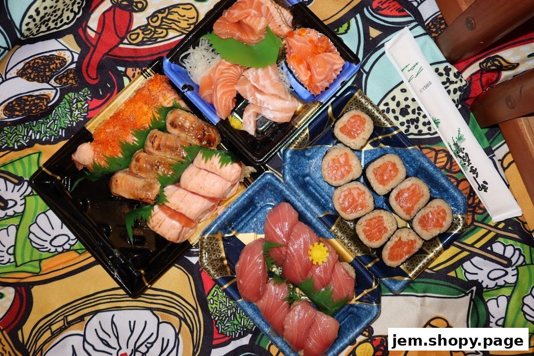 A variety of sushi and sashimi platters arranged on a colorful, patterned surface.