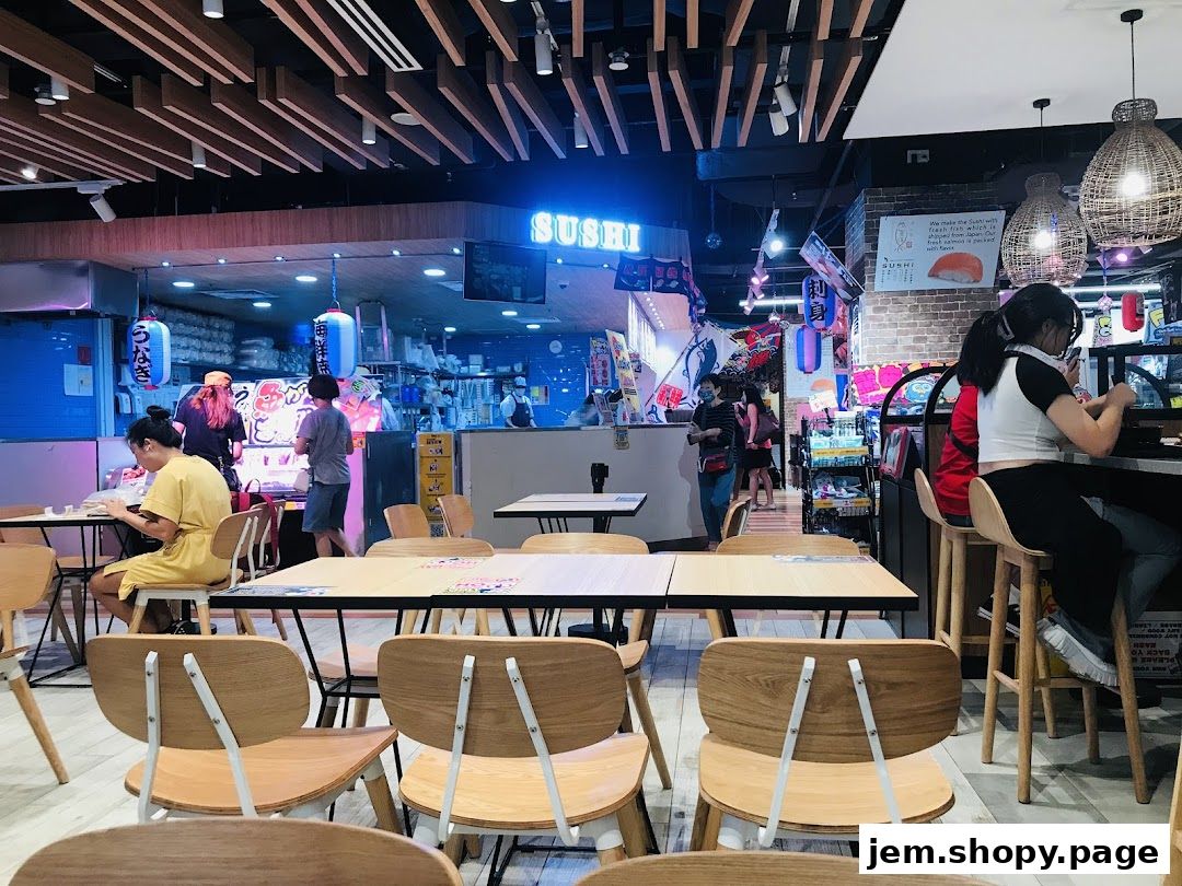 Interior view of a busy Don Don Donki sushi restaurant with diners and staff.