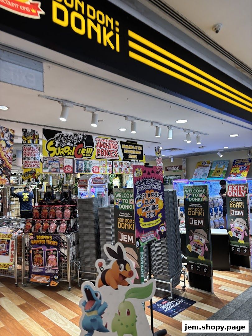The entrance of Don Don Donki JEM, featuring colorful signage and promotional displays.