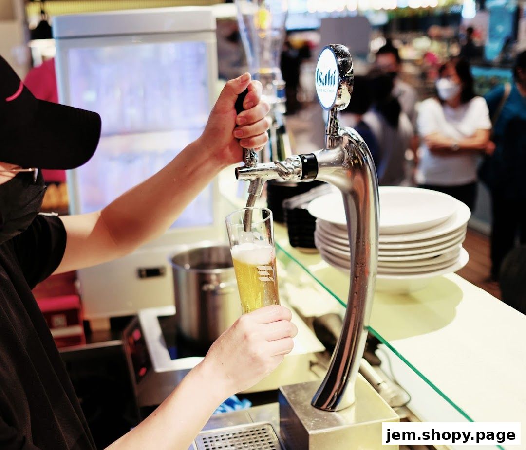 A bartender pours a beer from a tap at Don Oyster Bar-JEM.