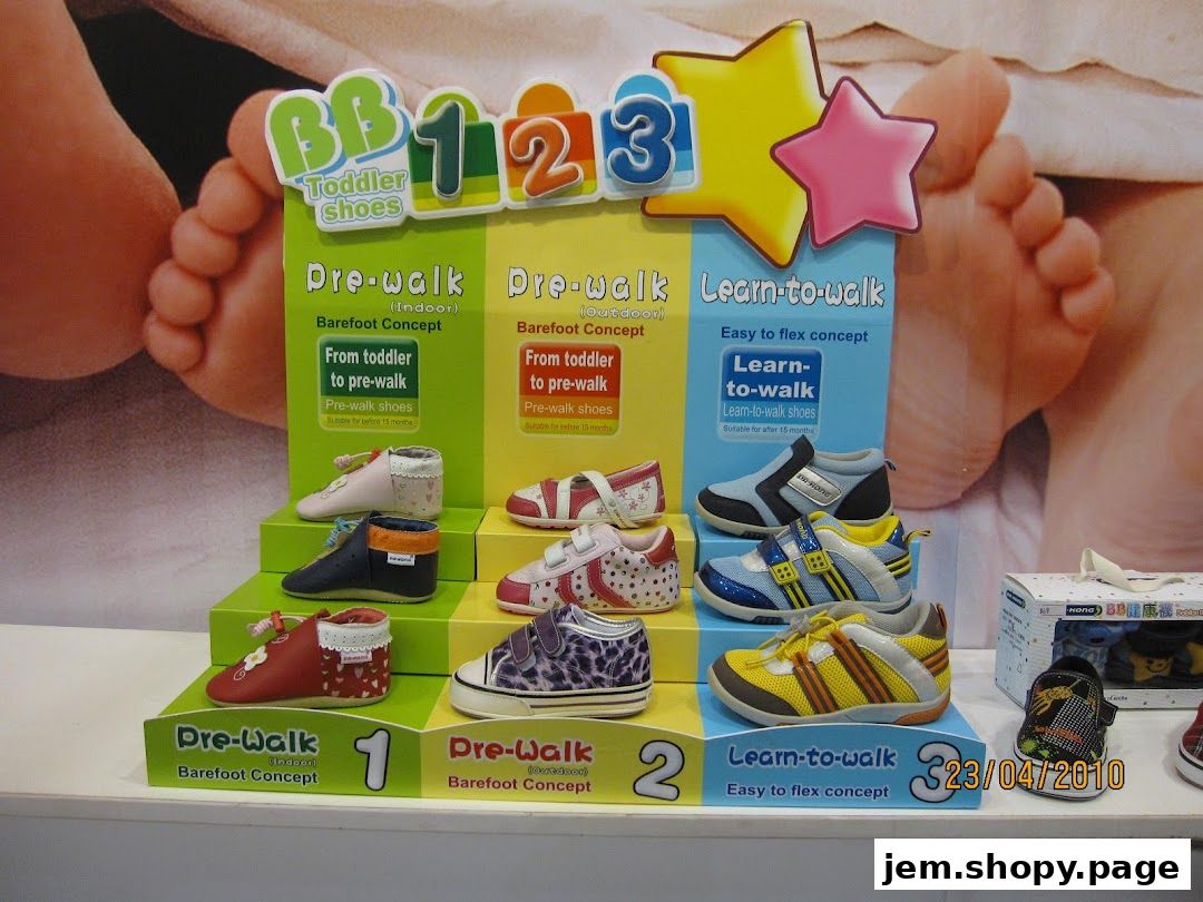 Display of Dr.Kong JEM toddler shoes categorized by developmental stage.