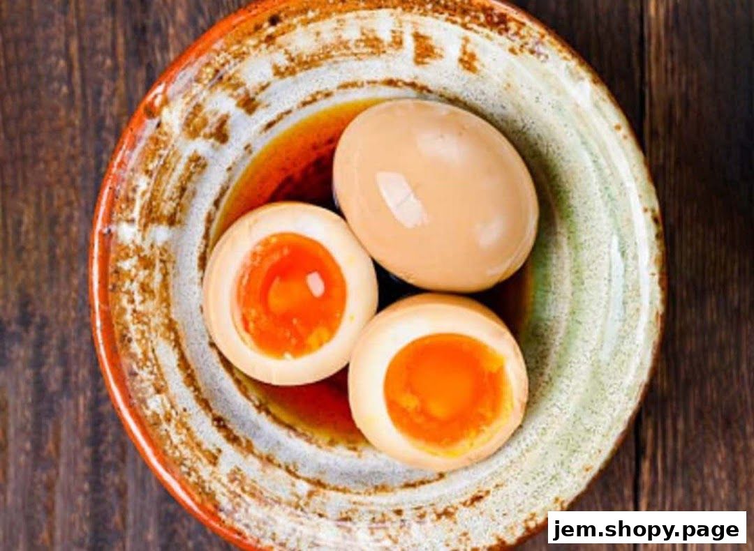 A close-up shot of three braised eggs in a rustic bowl with a wooden background.