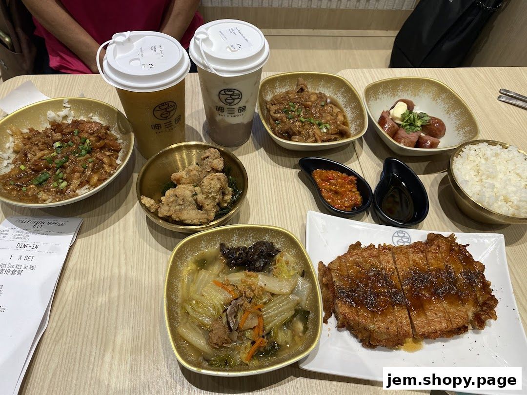 A table filled with various Taiwanese dishes and drinks from Eat 3 Bowls.