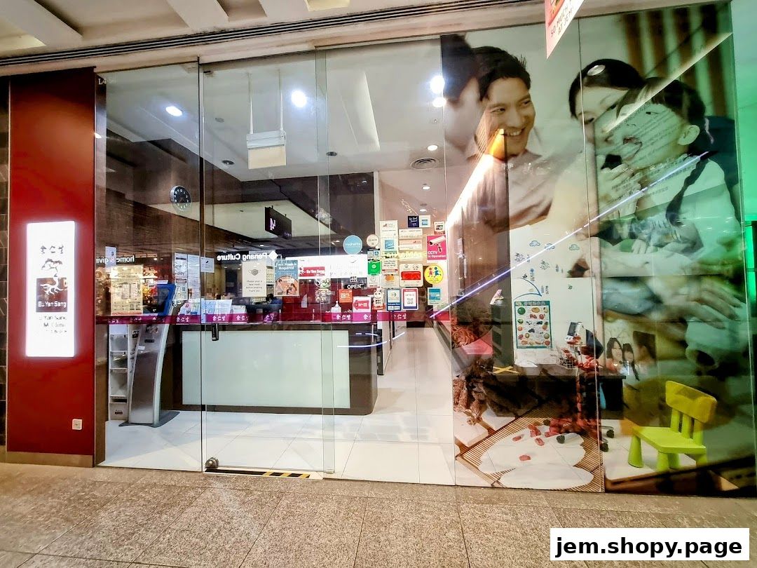 The entrance of Eu Yan Sang TCM Clinic at JEM, featuring glass doors and promotional graphics.