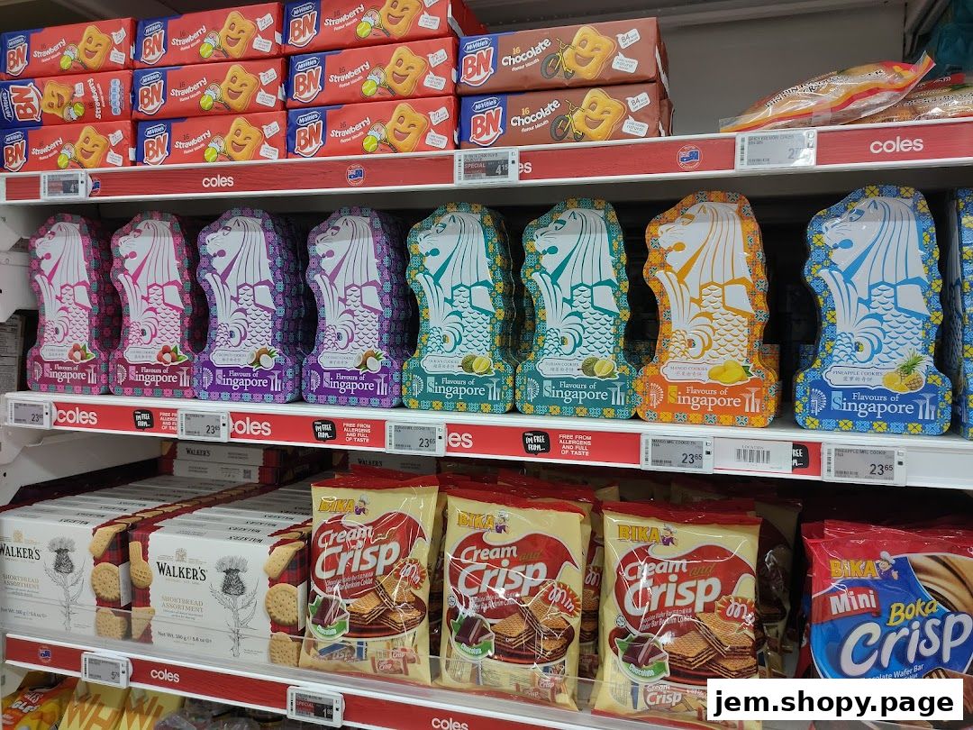 Shelves stocked with various cookies and snacks, including Singapore-themed Merlion-shaped tins.
