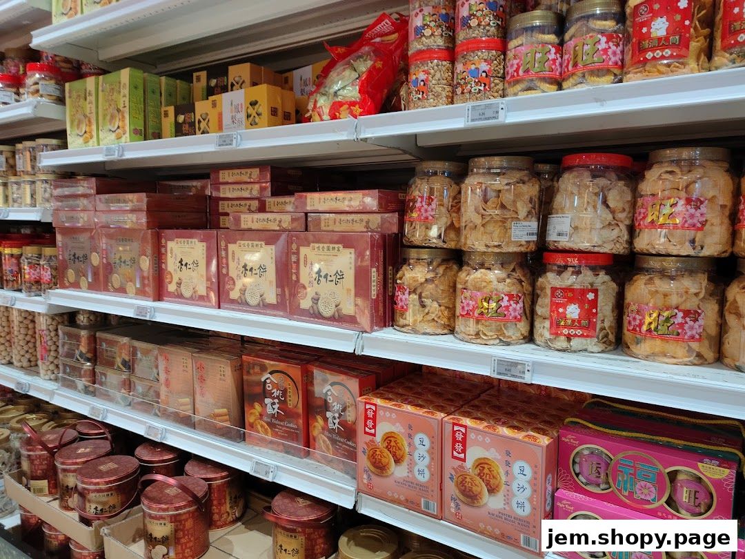 Shelves stocked with various packaged snacks and cookies, including jars and boxes.