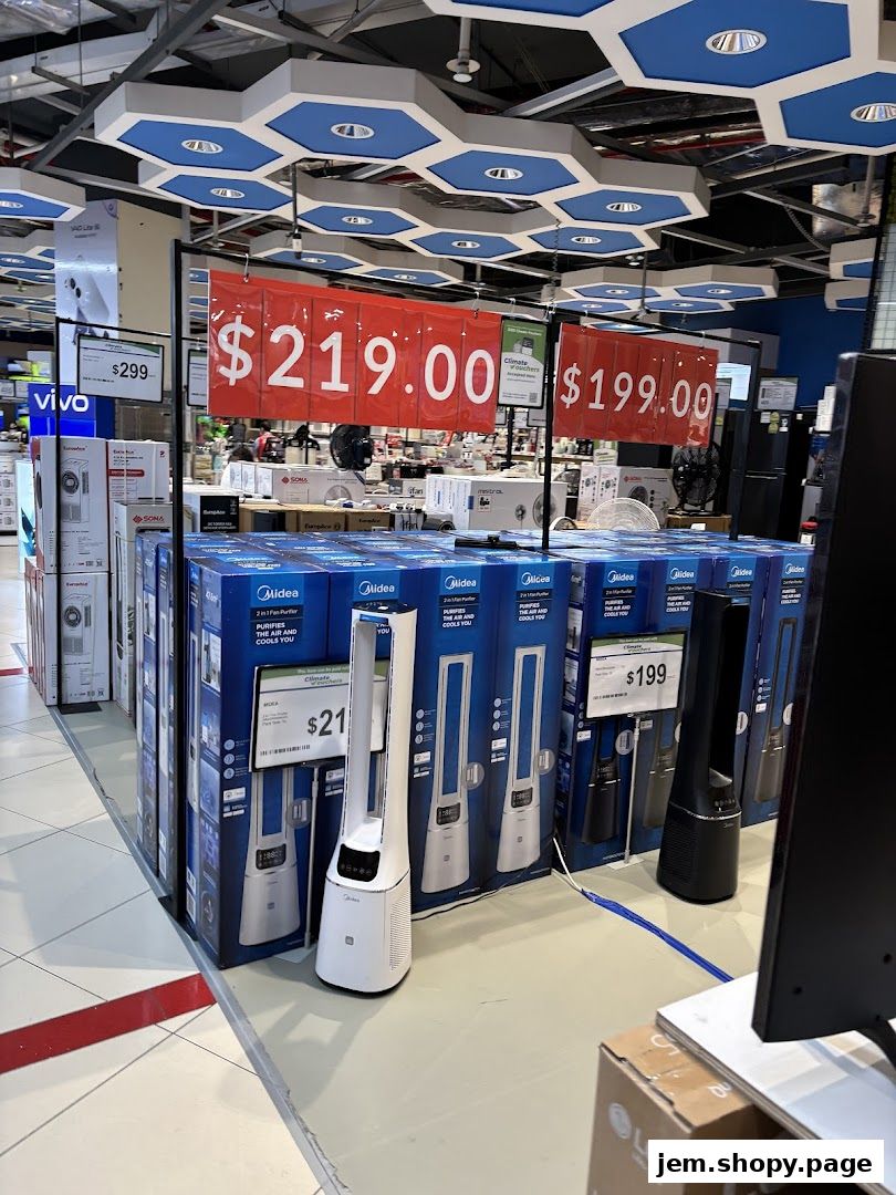 A retail display of Midea air purifiers and fans with price tags.