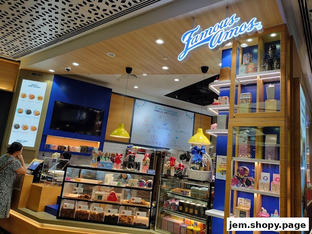 Famous Amos cookie shop with a display of cookies, gifts, and a service counter.