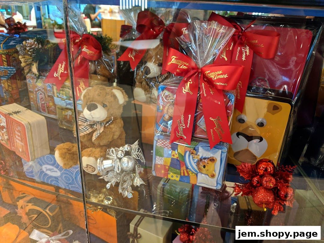 Famous Amos shop display featuring teddy bears, gift baskets, and cookie tins.