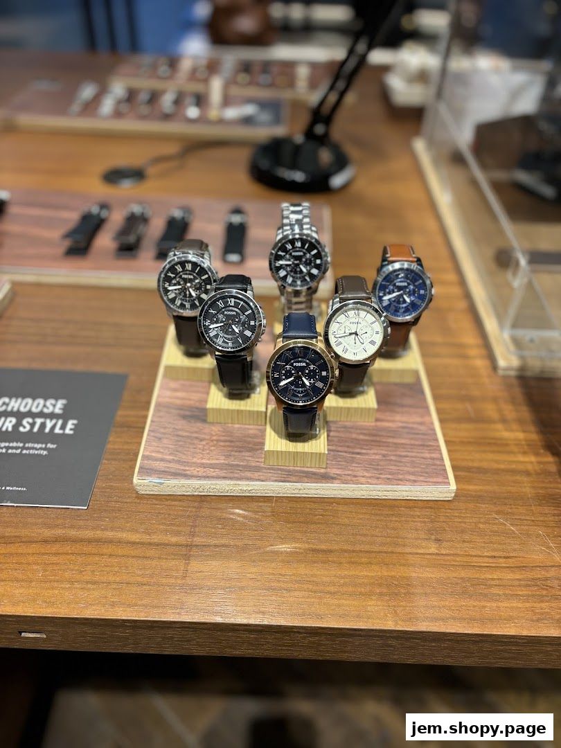 A display of various Fossil watches on a wooden stand.