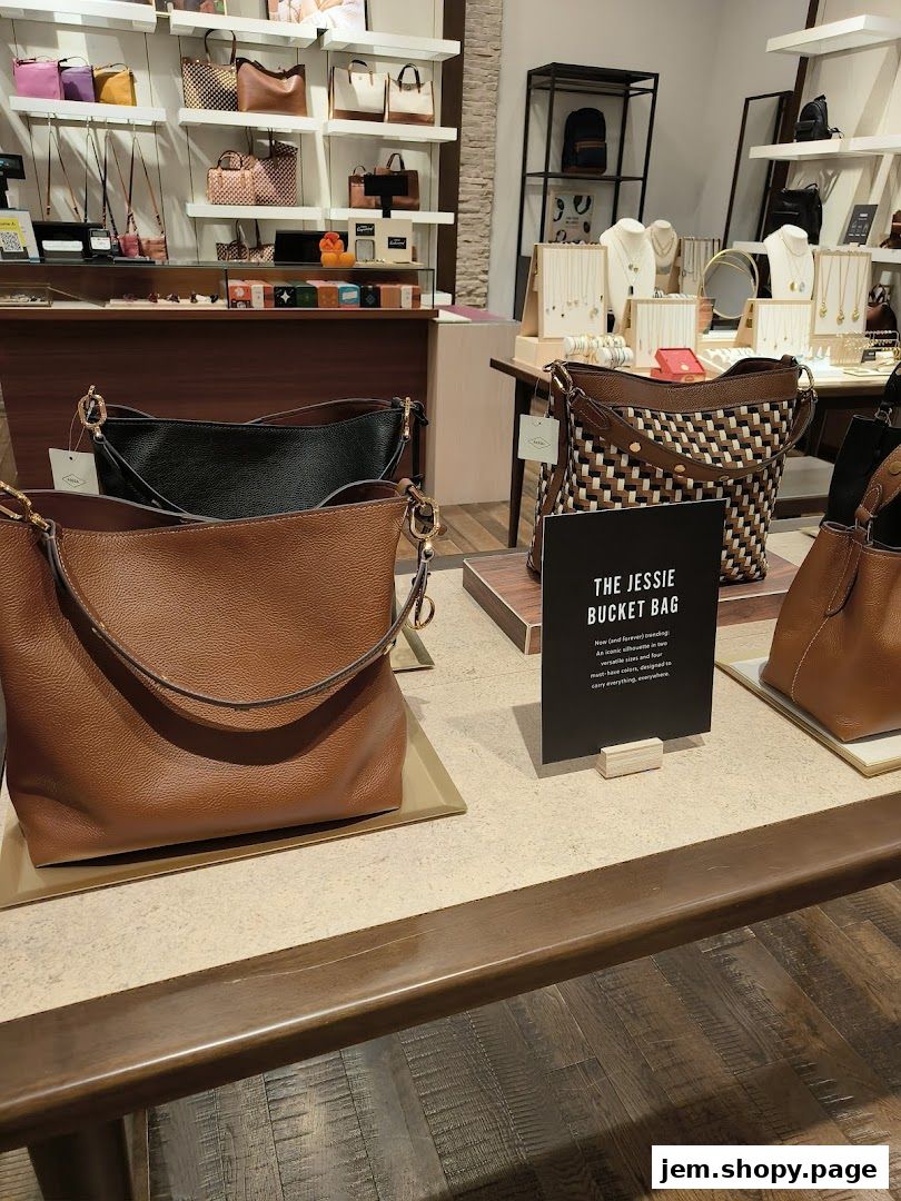 Interior view of a Fossil store showcasing various handbags and jewelry on display.