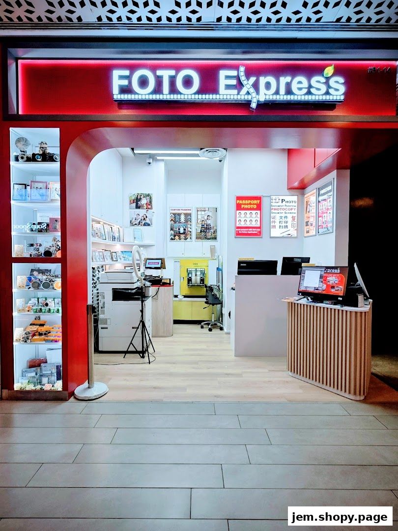 The entrance of Foto Express, a photo printing and services shop, with displays of cameras and photo frames.