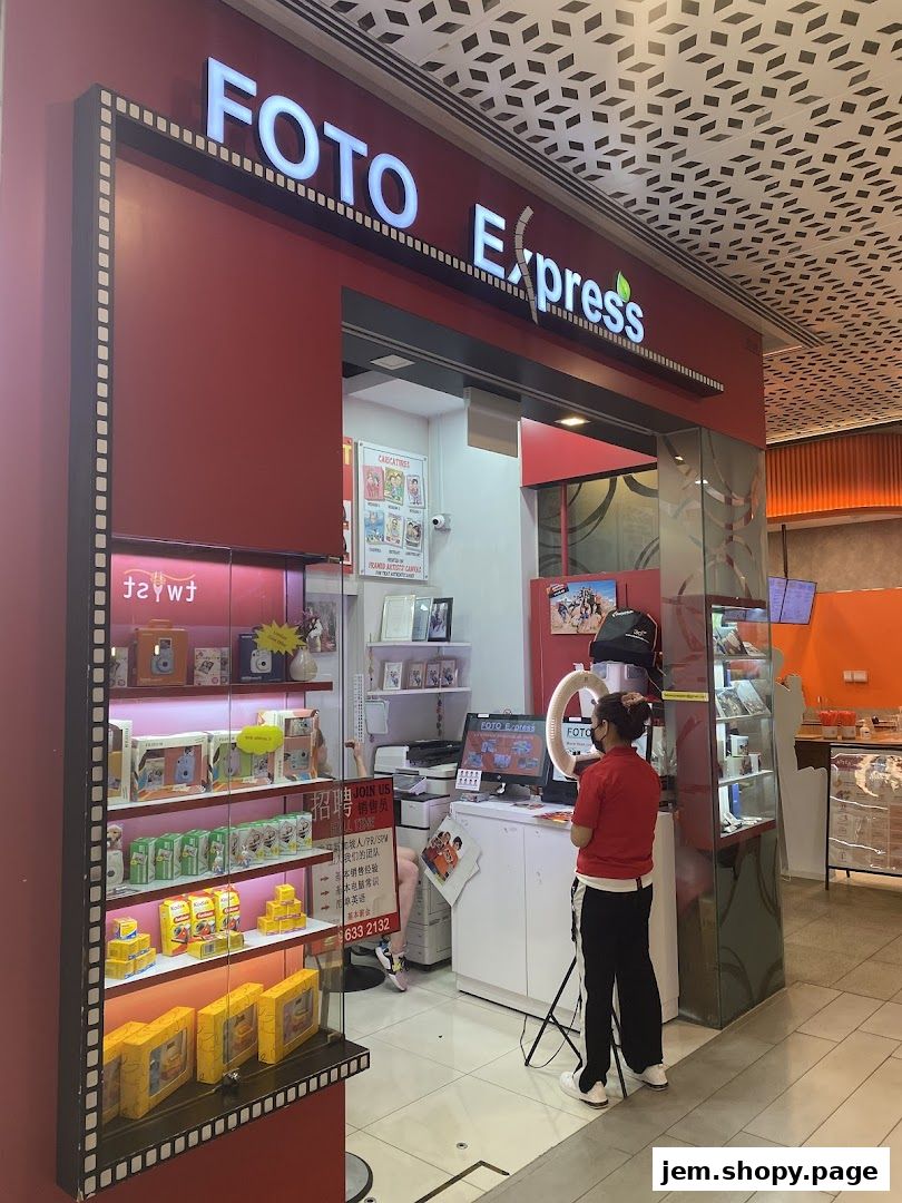 The exterior of a Foto Express shop with products displayed and a staff member at the counter.