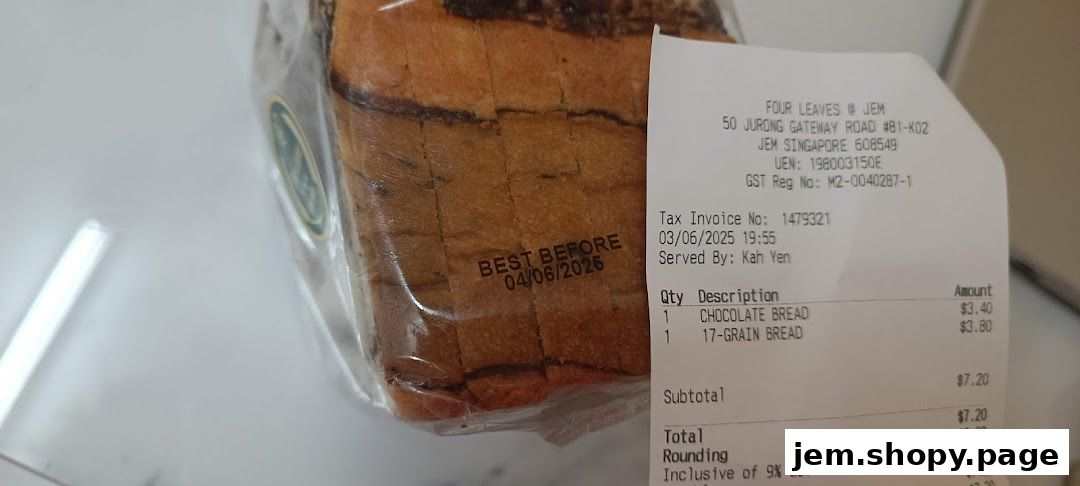 A loaf of chocolate bread with a receipt from Four Leaves bakery.