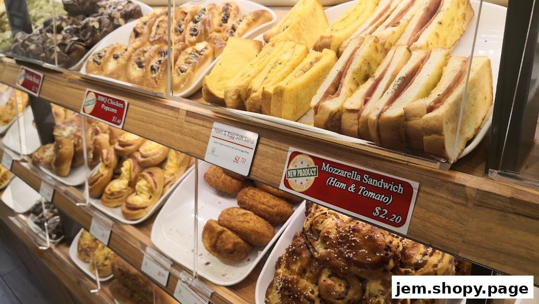 A display case filled with various baked goods and sandwiches from Four Leaves bakery.