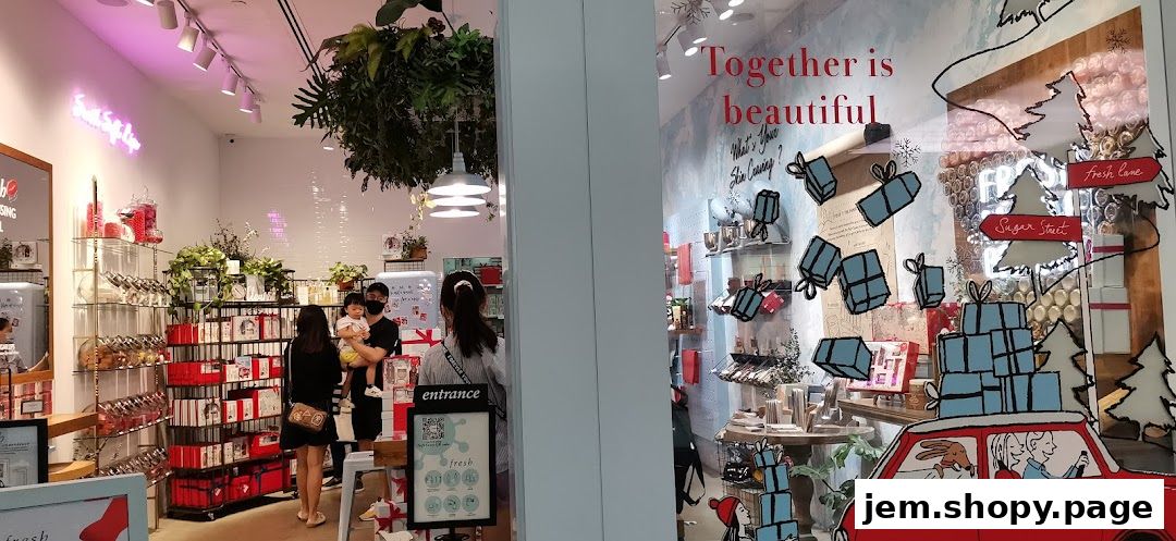 Interior view of a brightly lit shop with shelves of products and a festive window display.