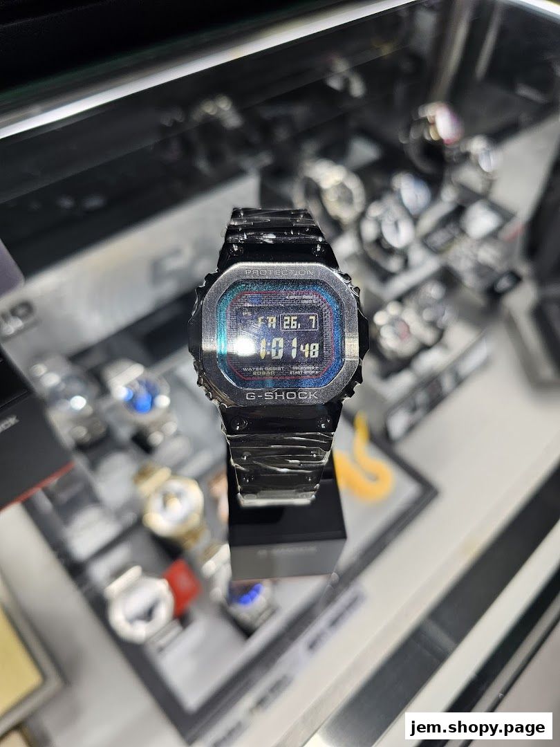 A close-up of a G-SHOCK watch displayed in a store with other watches in the background.