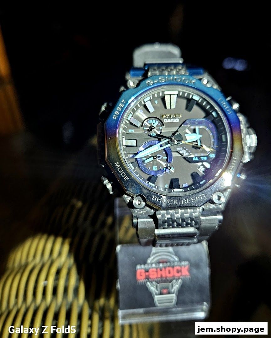 A close-up shot of a G-SHOCK CASIO watch with a metallic blue and silver design.