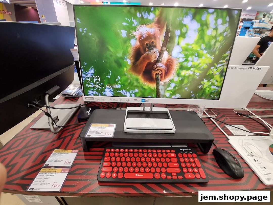 A computer monitor, keyboard, and mouse are displayed on a patterned surface.
