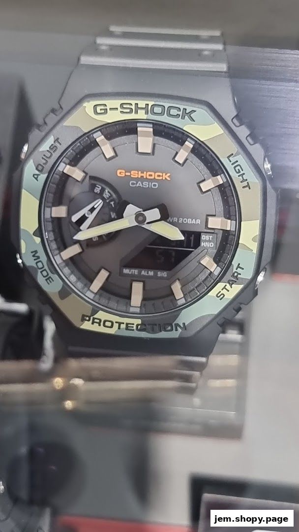 Close-up of a G-SHOCK CASIO watch with a camouflage bezel and digital display.