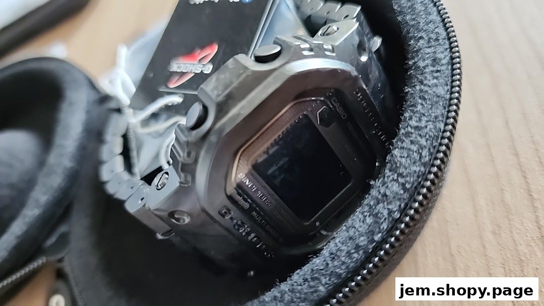 A close-up of a G-SHOCK CASIO watch in its protective case.