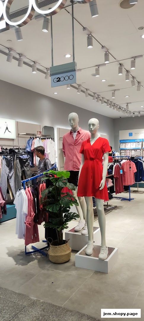 G2000 store interior with mannequins displaying clothing and racks of apparel.
