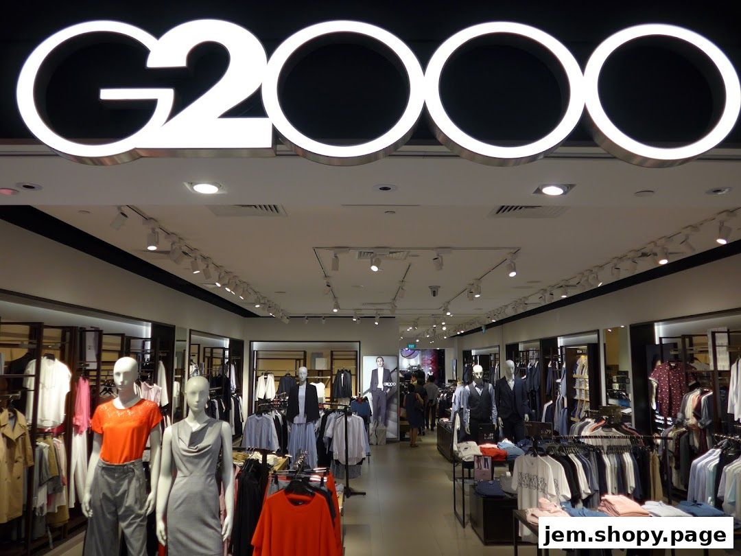 Interior view of a G2000 clothing store with mannequins and racks of apparel.