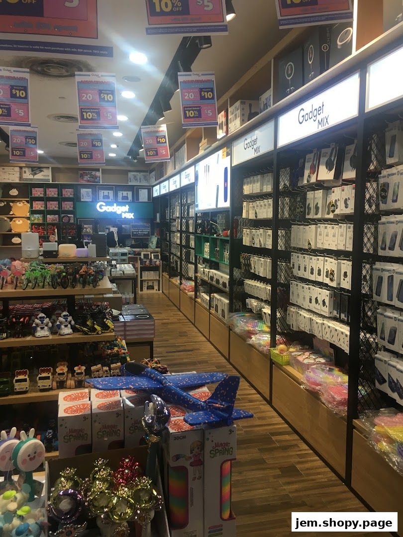 Interior view of Gadget Mix store showcasing shelves filled with electronics, toys, and promotional signs.