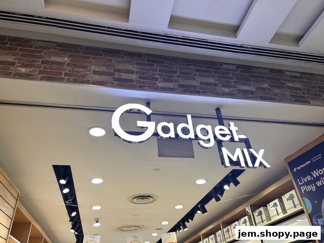 The illuminated sign for 'Gadget Mix' is displayed prominently above a retail store.